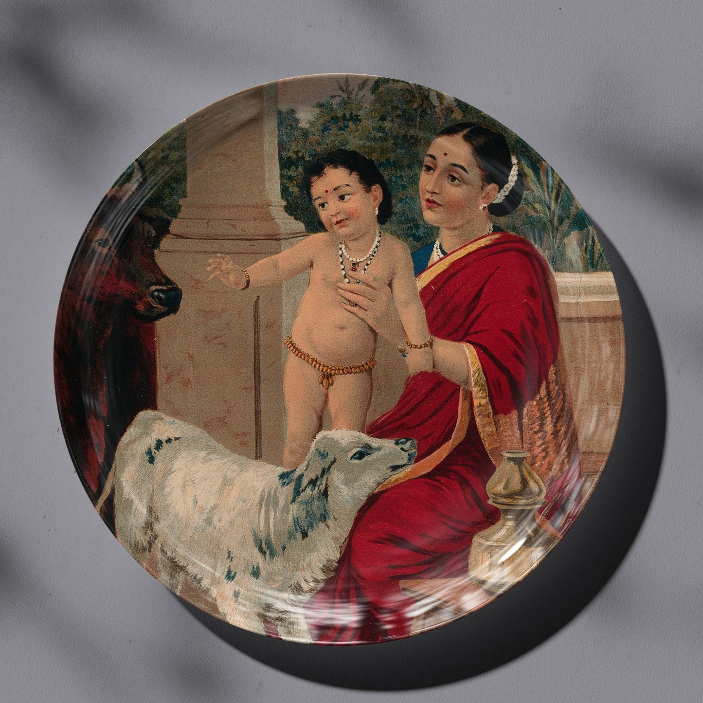 Krishna as an infant on Yasoda's lap playing with a cow and a calf by Ravi Varma Ceramic Plate for Home Decor