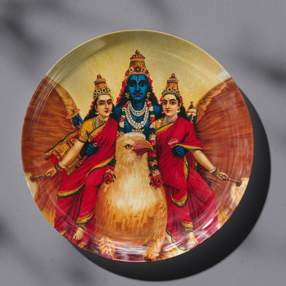 Vishnu accompanied by his wives riding on Garuda by Ravi Varma Ceramic Plate for Home Decor