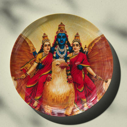 Vishnu accompanied by his wives riding on Garuda by Ravi Varma Ceramic Plate for Home Decor