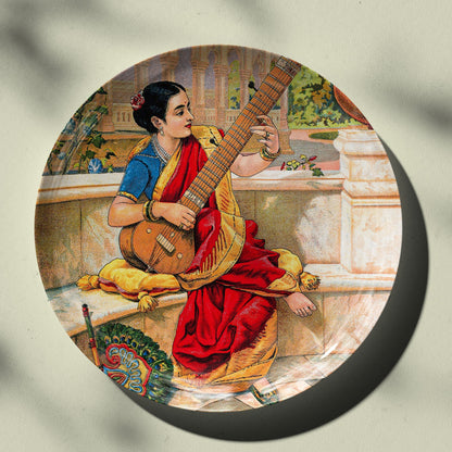 A seated Indian woman plays a sitar next to a garden pond by Ravi Varma Ceramic Plate for Home Decor