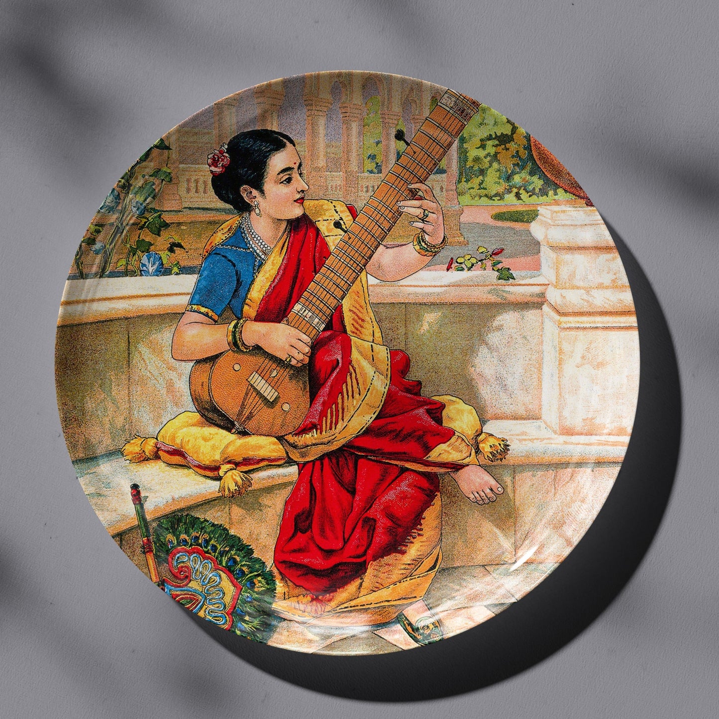 A seated Indian woman plays a sitar next to a garden pond by Ravi Varma Ceramic Plate for Home Decor